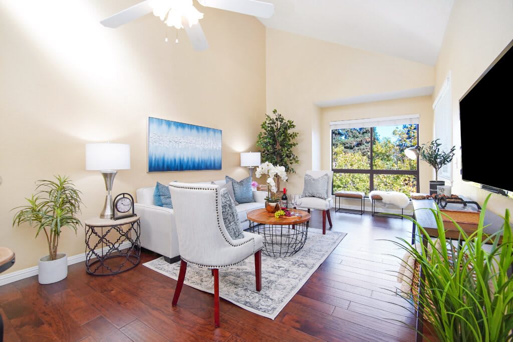 A modern living room with elegant furniture and abundant natural light.
