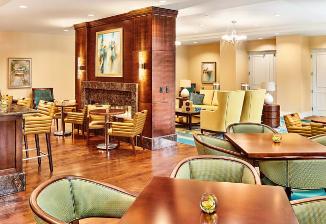 A modern lounge with comfortable seating and warm, inviting decor.
