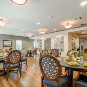A modern dining room with elegant furniture and decor.