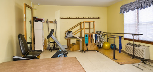 A well-equipped rehabilitation and exercise space featuring various fitness tools.
