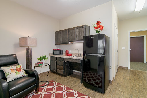 A cozy kitchen area featuring modern appliances and stylish decor.