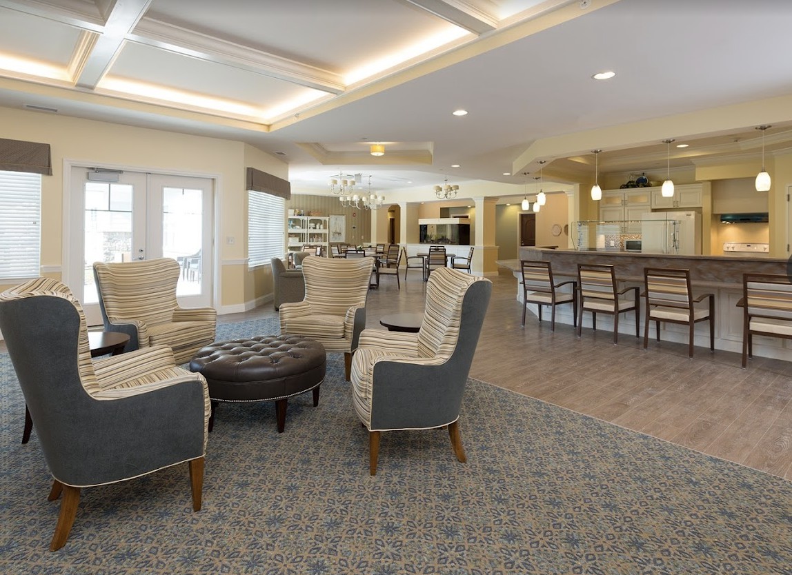 A modern lounge area with comfortable seating and ambient lighting.