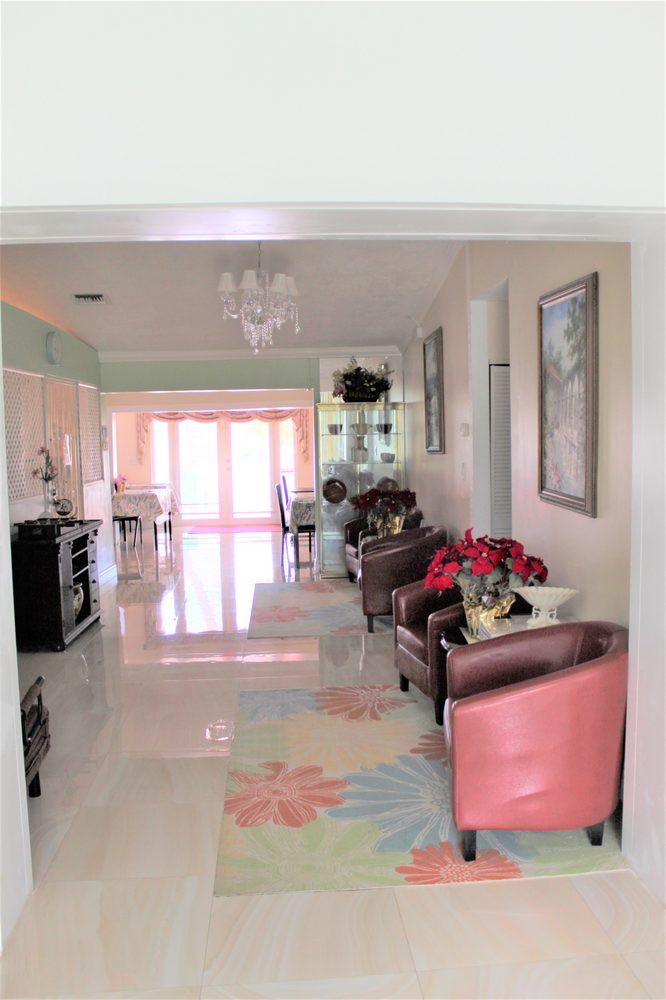 A cozy living space with modern decor and an open kitchen.