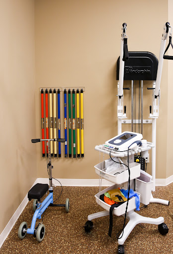 A well-equipped physical therapy space featuring a variety of exercise tools for rehabilitation.