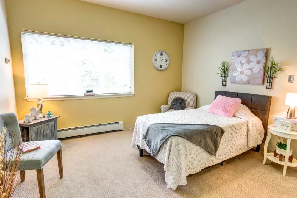 A cozy and well-decorated bedroom with a comfortable bed and neutral color palette.