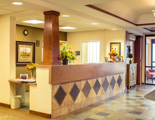 A welcoming reception area featuring a wooden counter and decorative elements.