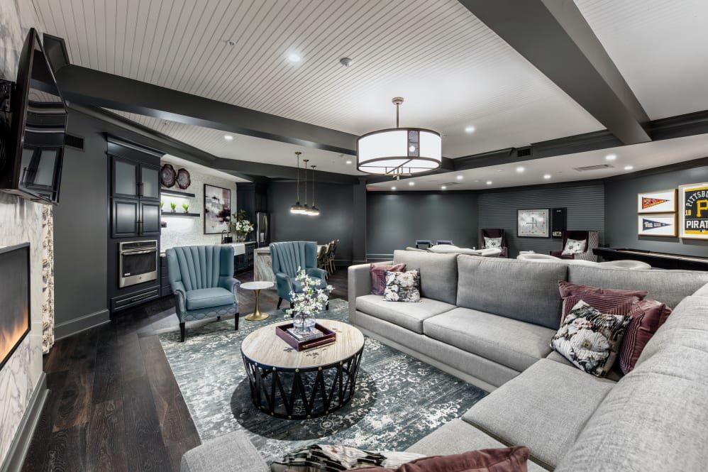 A modern living room with comfortable seating and elegant decor.