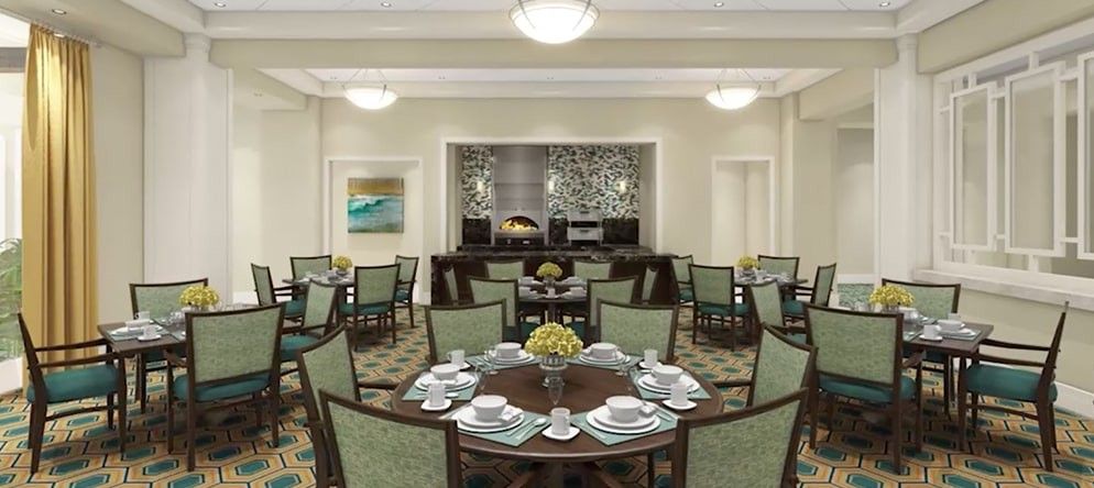 A well-appointed dining room with elegantly set tables and comfortable seating.