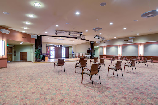 An empty conference room arranged with chairs, ready for a meeting or event.
