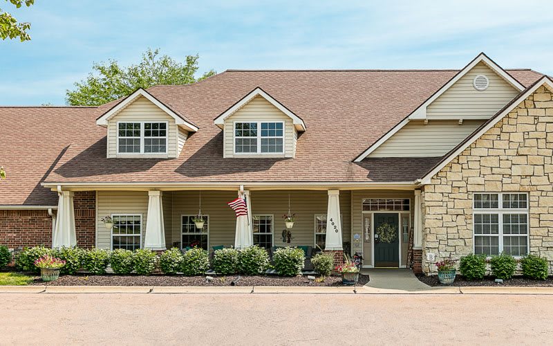 A suburban house with a gabled roof and front porch.