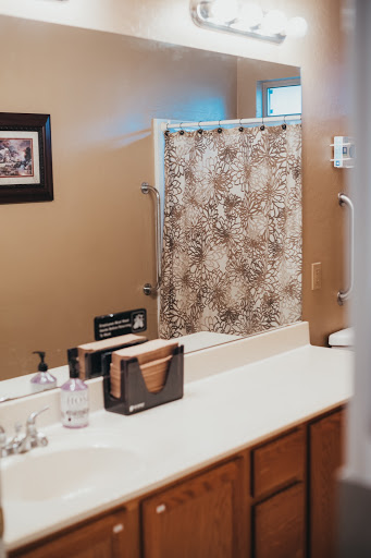 A cozy bathroom setting featuring a stylish shower curtain and clean vanity.