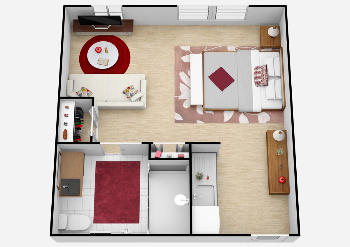 A top-down view of a modern apartment floor plan featuring a bedroom, kitchen, and living area.