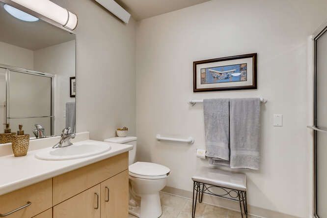 A clean and well-organized bathroom with modern amenities.