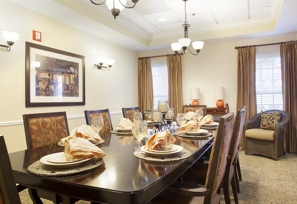 An elegantly set dining room ready for a formal meal.