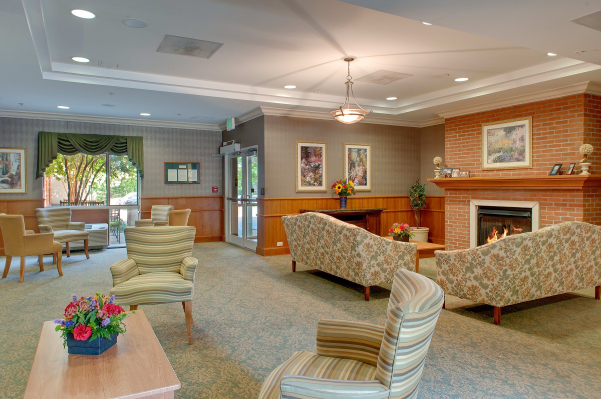 A cozy living room with comfortable seating, a fireplace, and tasteful decor.