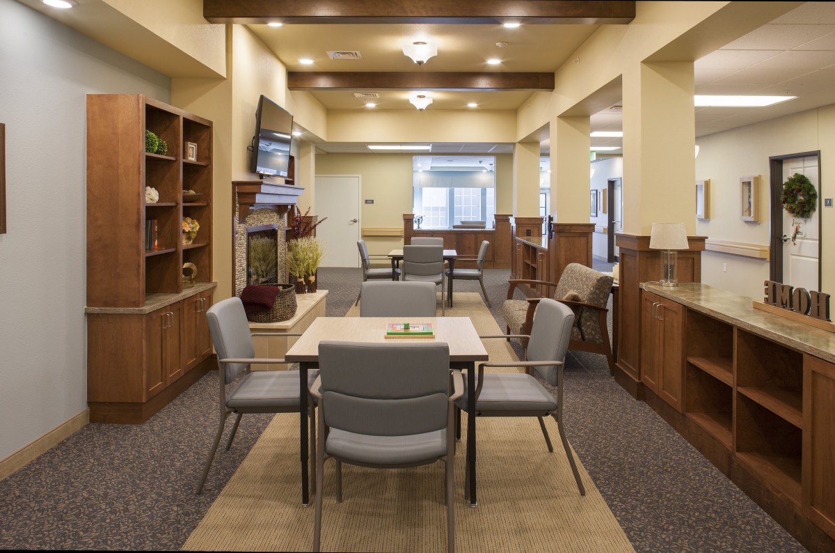 A modern dining area with comfortable seating and elegant lighting.
