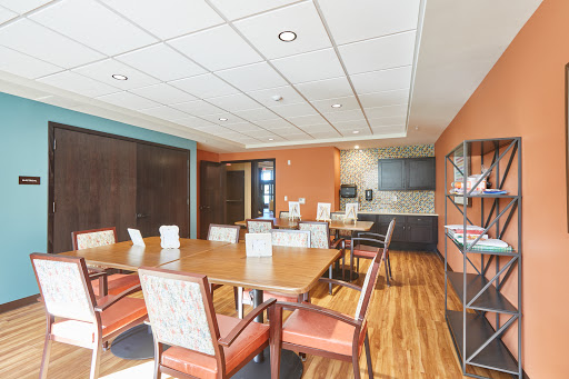 A well-furnished conference room designed for meetings and collaborative work.