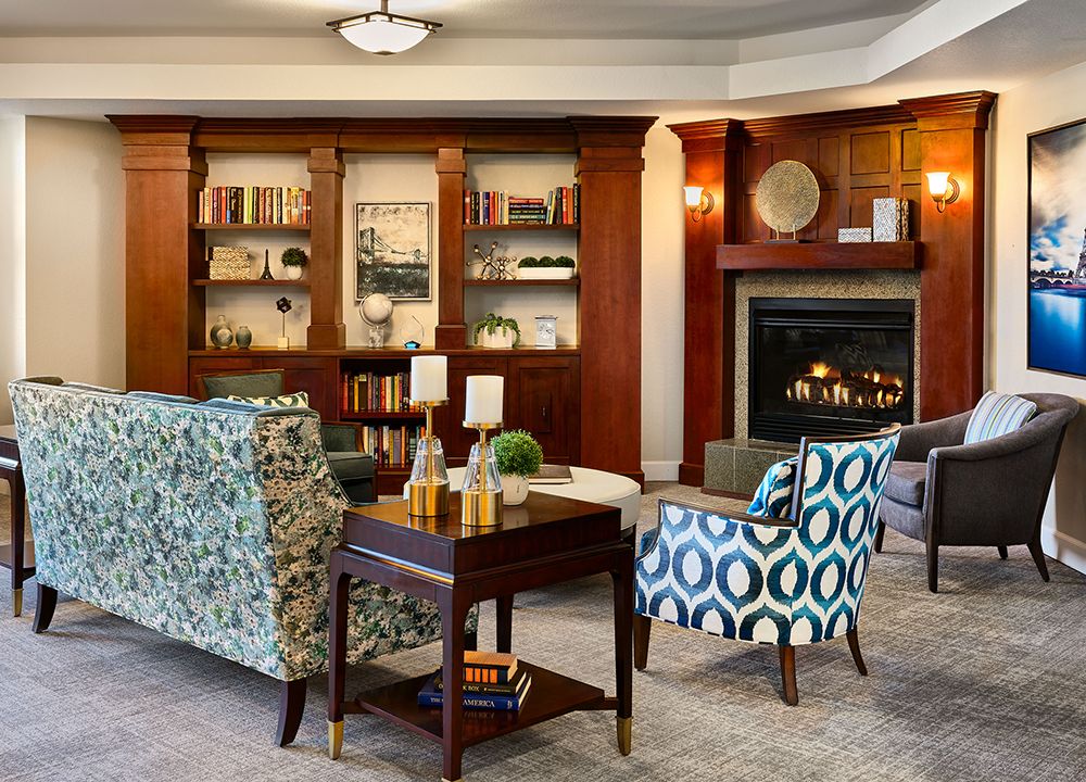 A cozy living room with stylish furniture and a warm fireplace.