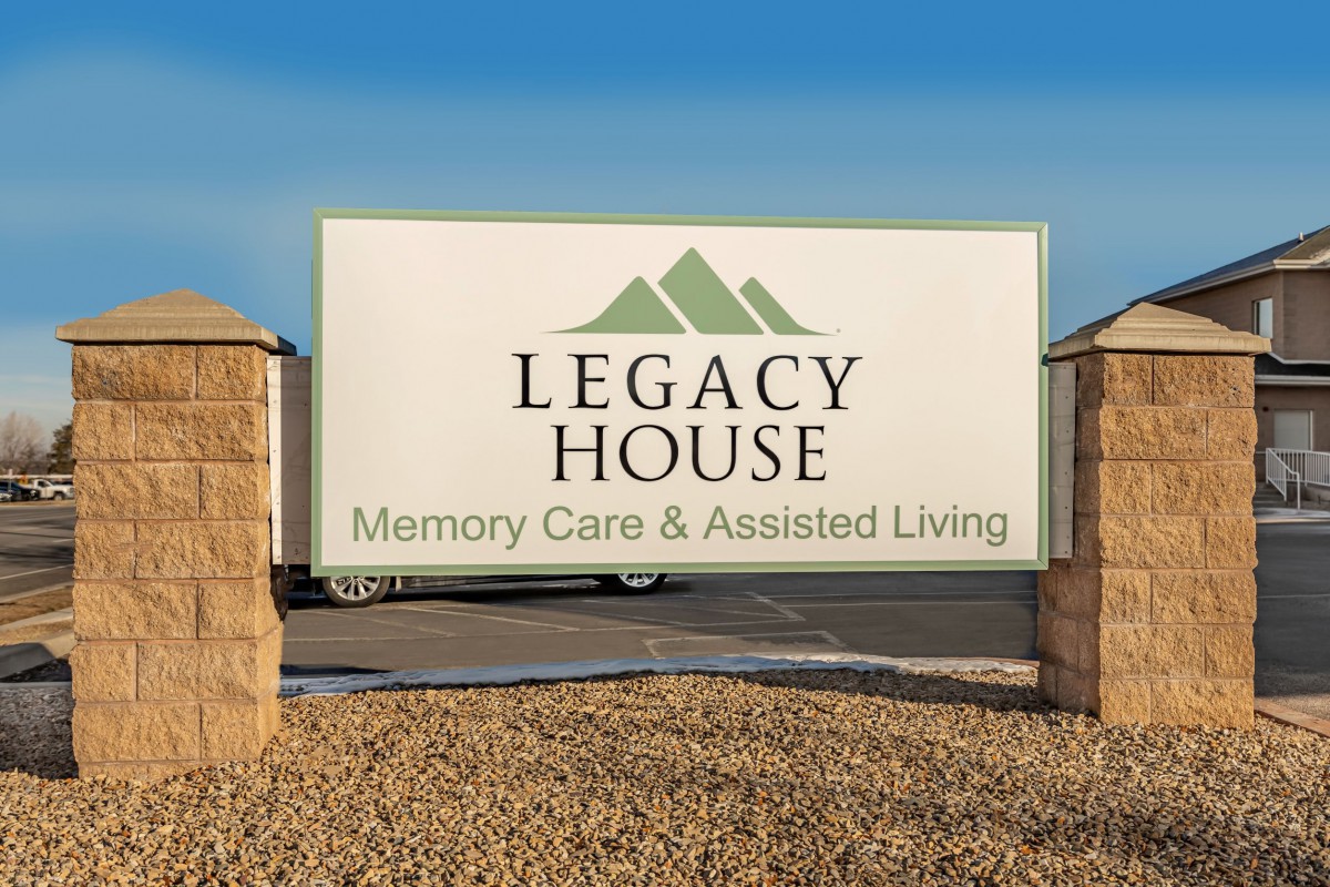 A sign for Legacy House, providing memory care and assisted living.