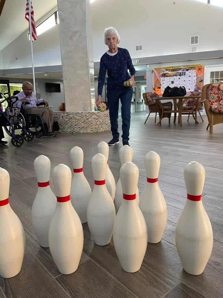 A person enjoying a game of indoor bowling.