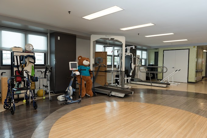 A fitness center with various exercise and medical equipment.