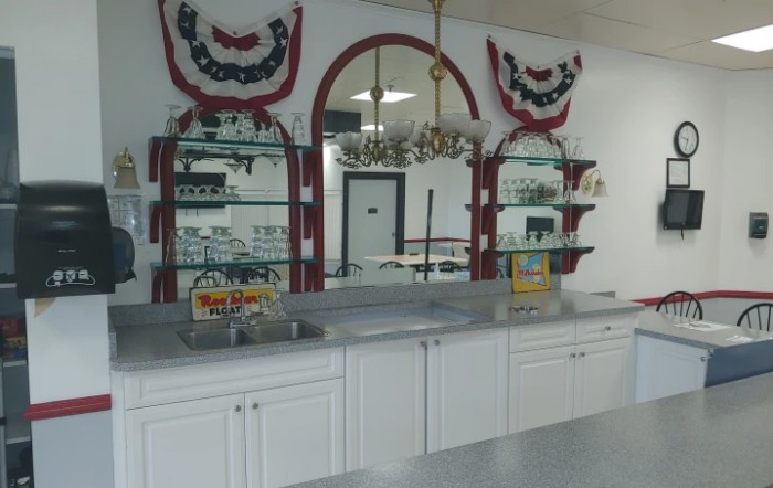 A shop counter with decorated shelves and a patriotic theme.