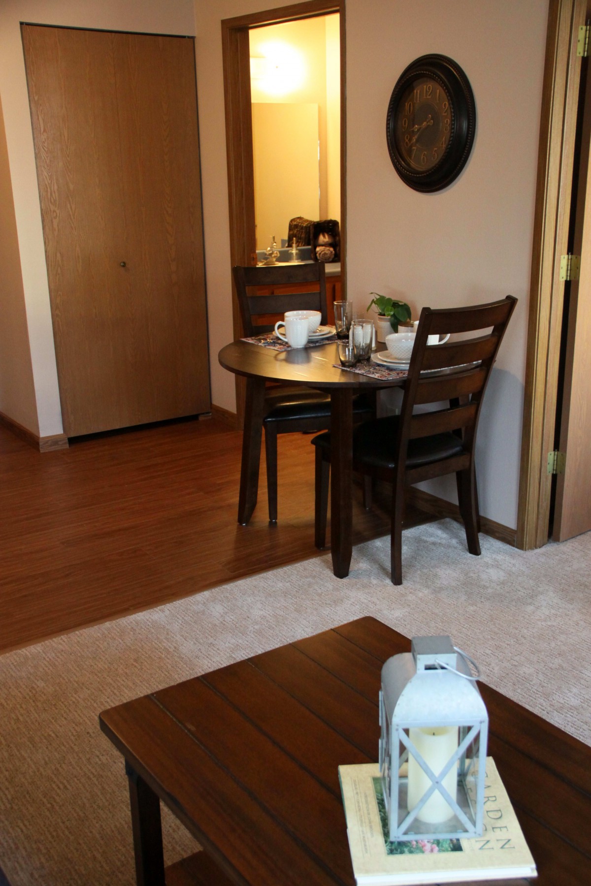 A cozy dining area with a wooden table and chairs in a home's interior.