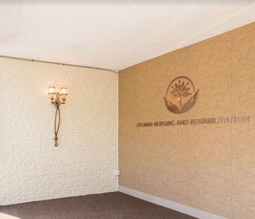 A sophisticated interior featuring a decorative wall sconce and branding.