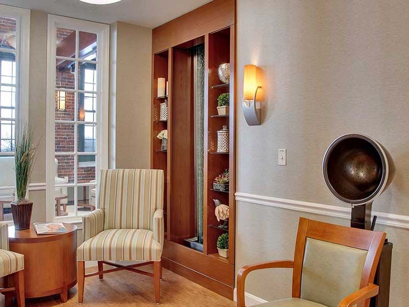A cozy living room with elegant furniture and warm lighting.