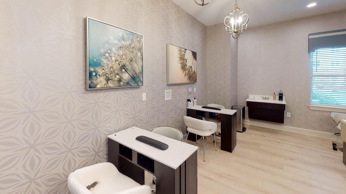 Modern and stylish nail salon interior with elegant decor and artwork.