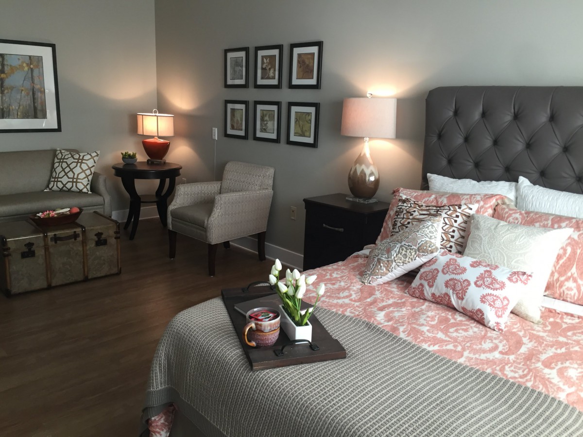 A cozy bedroom with stylish decor and comfortable furnishings.
