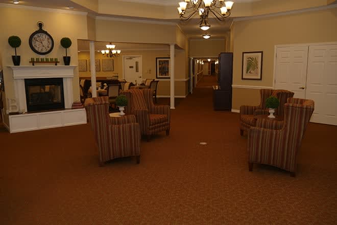 A cozy lobby with comfortable seating and warm lighting.
