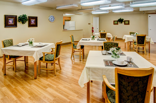 A cozy dining area with neatly arranged tables and elegant decor.