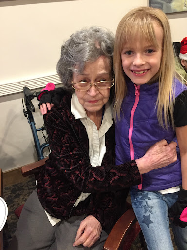 A joyful moment shared between a grandmother and her granddaughter.