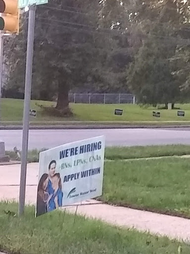 A sign advertising job openings.