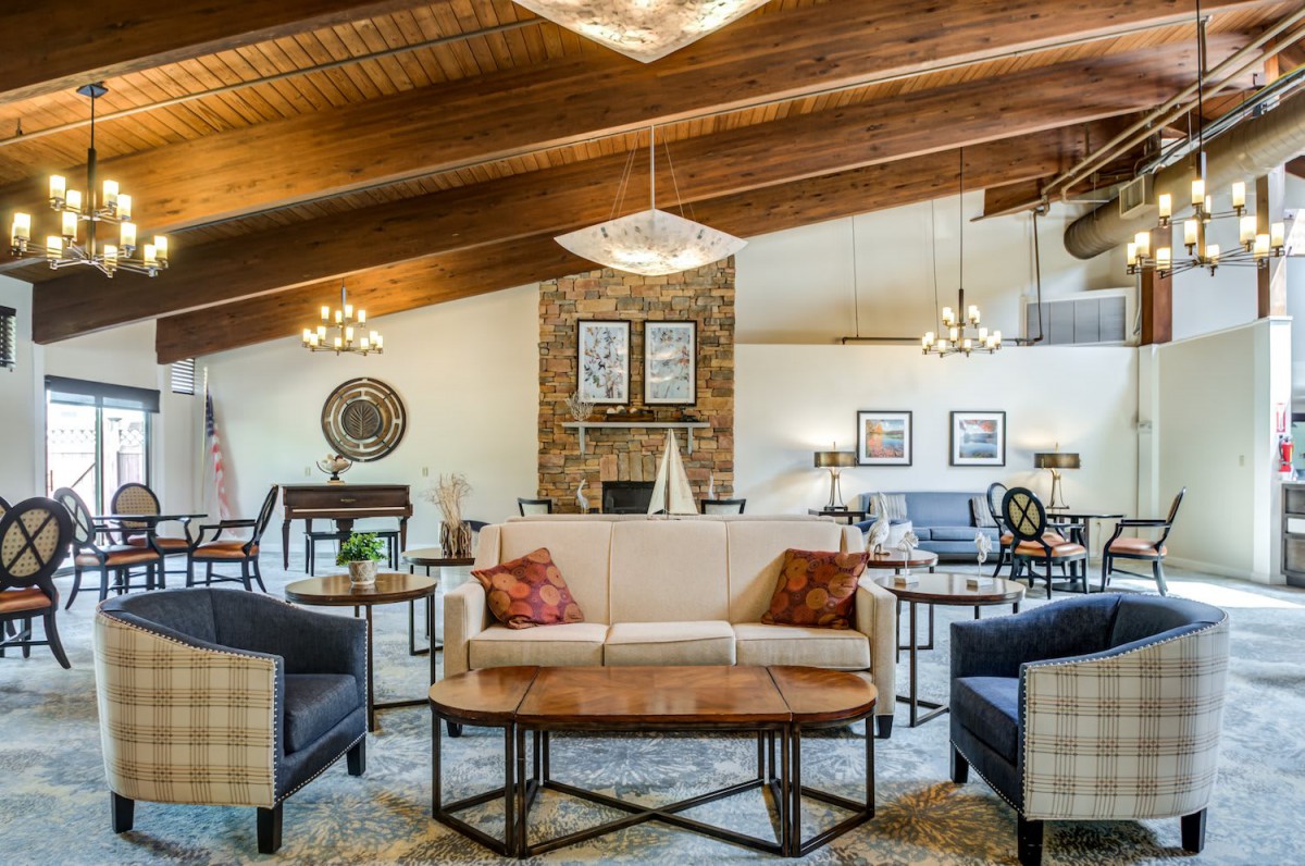 A cozy living room with a vaulted ceiling and elegant decor.