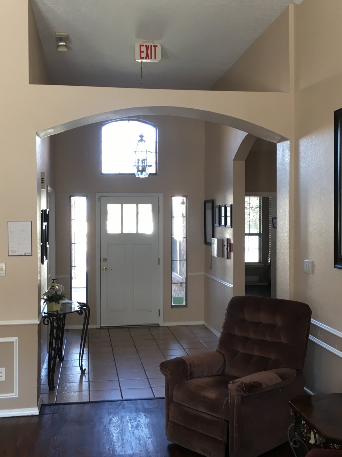 Bright and welcoming home entryway with natural light and elegant decor.