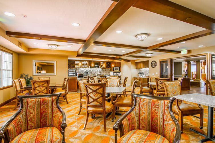 A warm and inviting dining area with elegant furniture and ambient lighting.