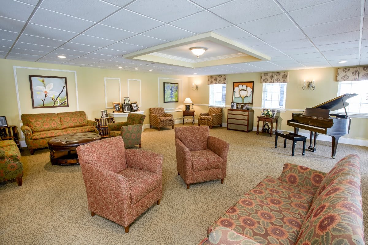 A spacious and well-furnished living room with comfortable seating and elegant decor.