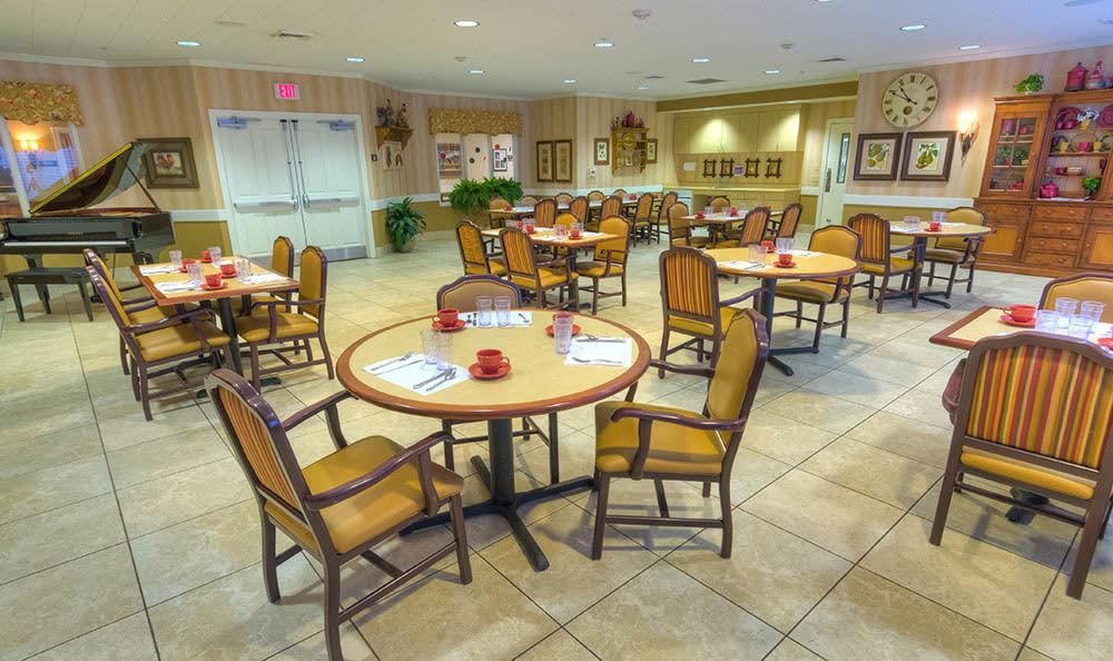 A well-arranged dining area with tables and chairs set up for guests.