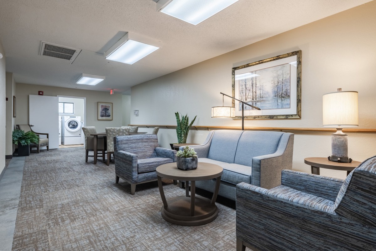 A cozy waiting room with comfortable seating and modern decor.