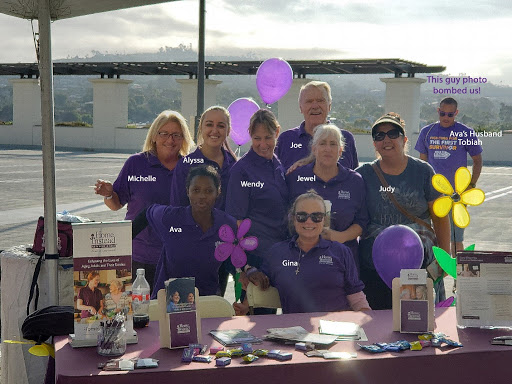 A group of dedicated individuals at a community event, showcasing their teamwork and enthusiasm.