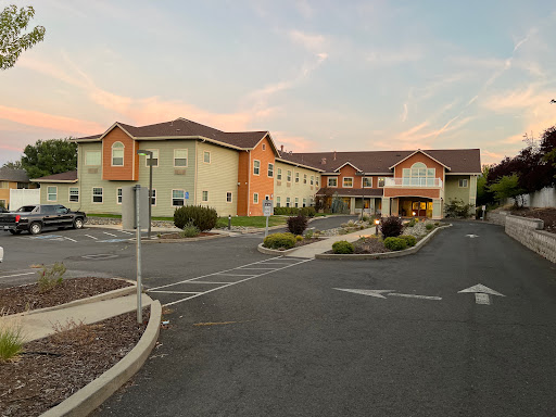 A welcoming hotel complements the evening sky as guests arrive.
