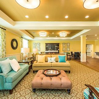 A cozy living room with comfortable seating and warm lighting.