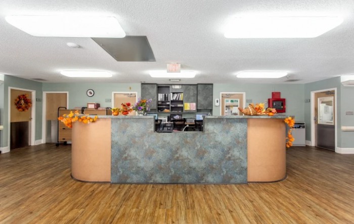A neatly organized reception desk with decorations.