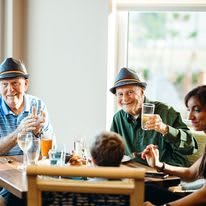 A family enjoying a meal together at a restaurant.
