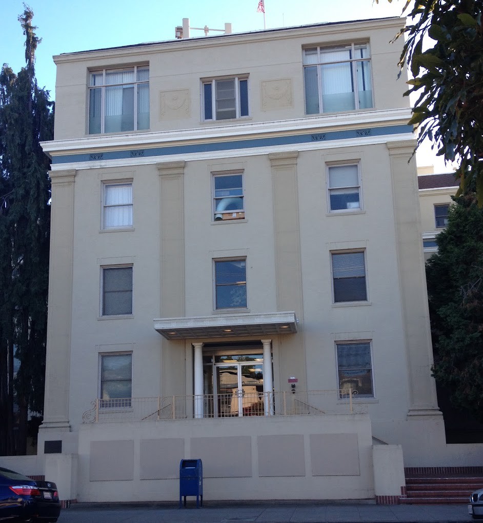 A multi-story residential building with a classic architectural design.