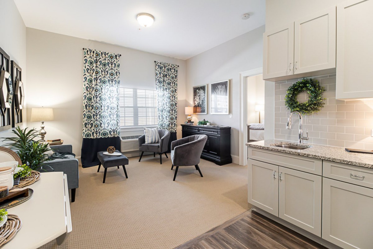 A cozy living room with modern furniture and elegant decor.