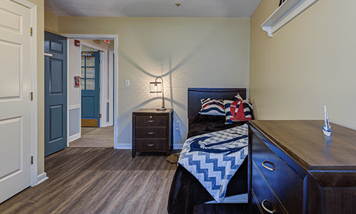 A cozy bedroom with modern furniture and stylish decor.