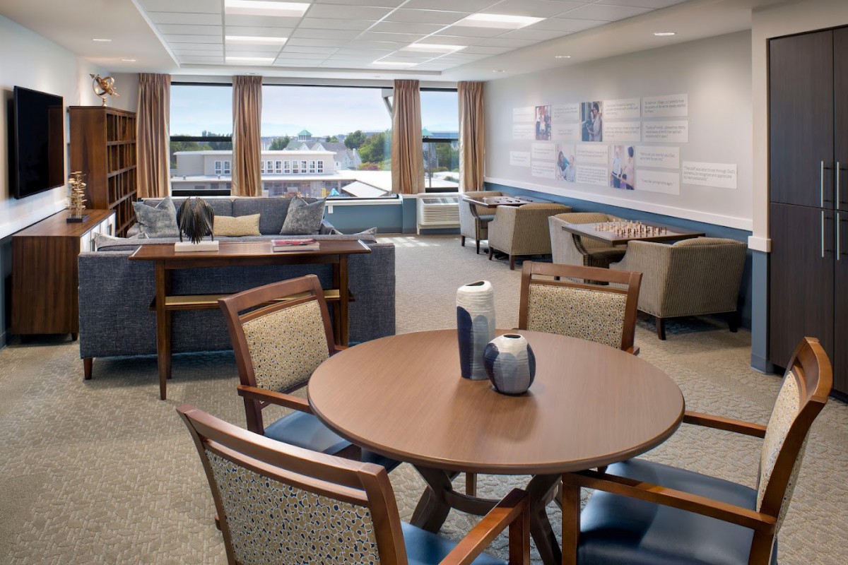A modern waiting room with comfortable seating and ample natural light.